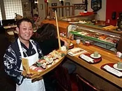 Kabuki owner K.J. Lee serves sushi for two deluxe.