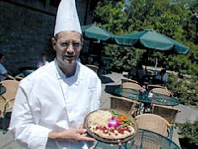The Pool's executive chef, Peter Veach, serves planked whitefish with cherries and almonds.