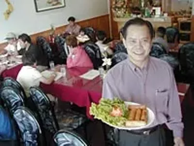 Thuy Trang: Owner Son Nguyen serves cha gio (crispy egg rolls).