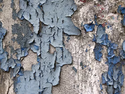 Paint peeling from an old home.