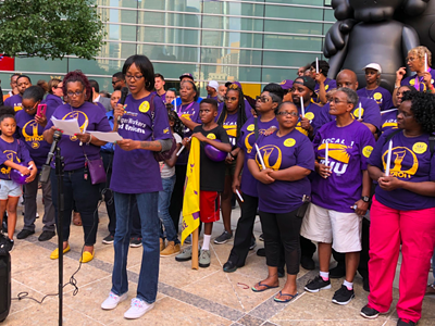 Detroit janitor represented by the SEIU joins in announcing vote to strike if demands for $15-an-hour minimum wage aren't met.