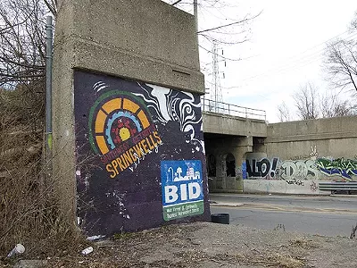 A hand-painted sign welcomes visitors to “Springwells Village” — though many residents are unfamiliar with that name.