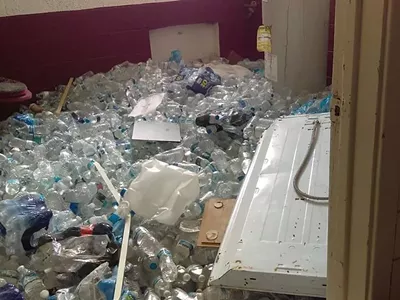 Bottled water covers the floor of a vacant school in Flint.