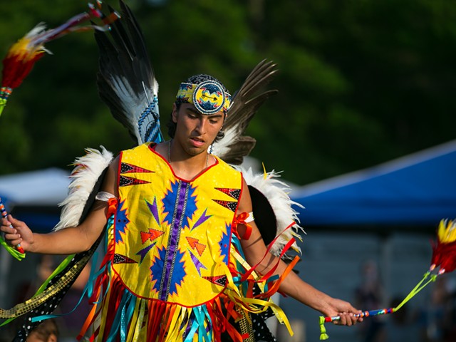 A young male fancy dancer at the Little River Band of Ottawa Indians annual Pow wow, in full regalia.
