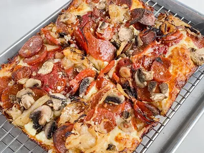 “The Granny” from Como's, with pepperoni, mushrooms, and caramelized onions.