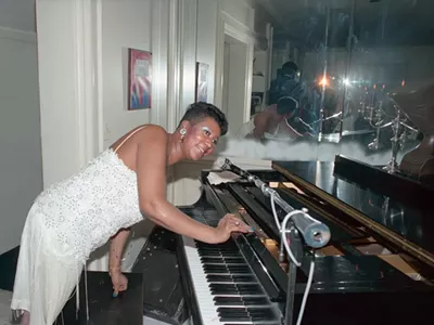 Aretha Franklin entertaining at her home during one of her Christmas parties.