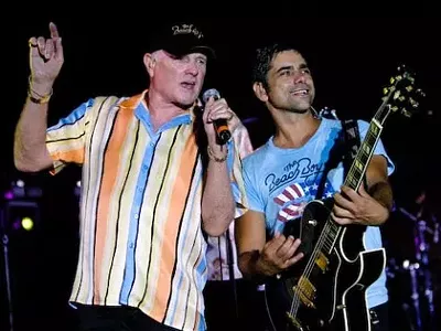 NOTE: John Stamos will not be joining the Beach Boys for their area show... or will he?