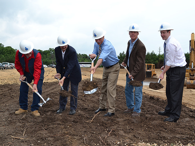 The men of the KWA, including Genesee County Drain Commissioner/KWA CEO Jeff Wright (center) and Flint Mayor Dayne Walling (far right) break ground for the new pipeline.