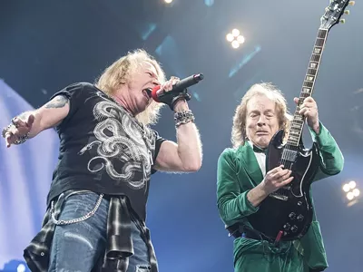 Axl Rose and Angus Young onstage at The Palace of Auburn Hills on Friday.