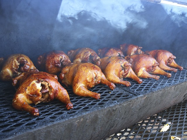 Chicken on the smoker at Satchel’s BBQ.