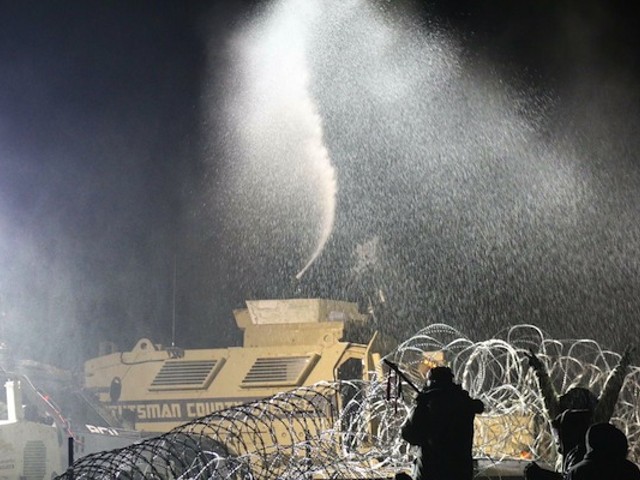 Among the arsenal of weapons deployed against protestors: water cannons in freezing weather.