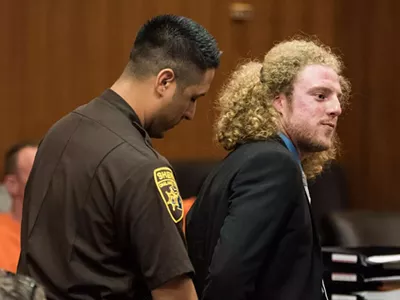 Activist Andrew Cissell stands in Oakland County Circuit Court on July 11 for sentencing on a conviction of illegal sale of medical marijuana.