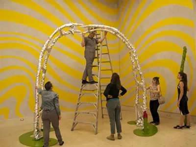 Cranbrook Academy of Art graduate student Philip Košćak installs a sculpture for the annual student exhibition.