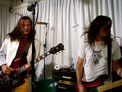 Jeff and Steven McDonald performing live in 2012.