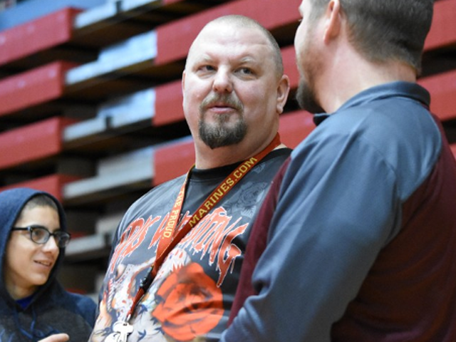 Female wrestling coach, promoter, and advocate Brent Harvey, center, has died.