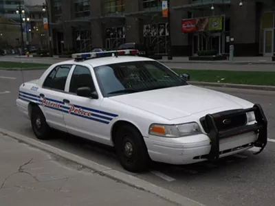 Image: Six Detroit cops charged with extortion for taking bribes from auto repair shop owners