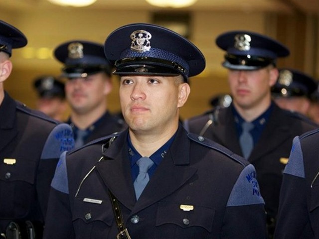 Bessner, among a sea of other white officers, during his Michigan State Trooper graduation in 2012.