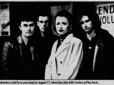 The Cranberries with O'Riordan (second from right) in a promotional poster for their August 17, 1996 concert at Pine Knob Music Theater.