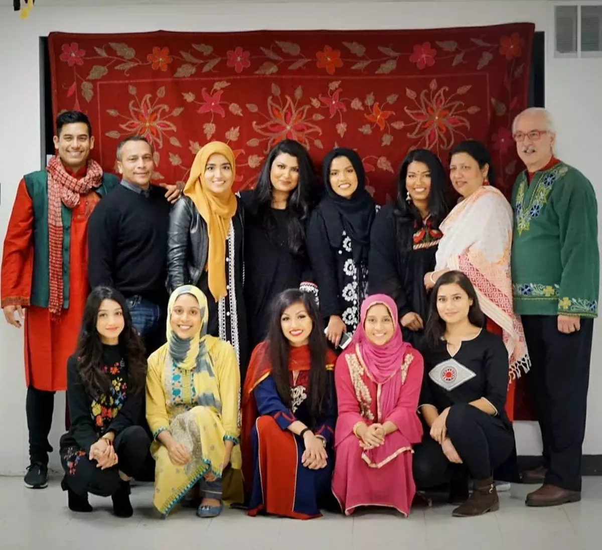 Image: Bill Meyer pictured with OneHamtramck's Bangaladeshi mural committee, in the back row in the green shirt.