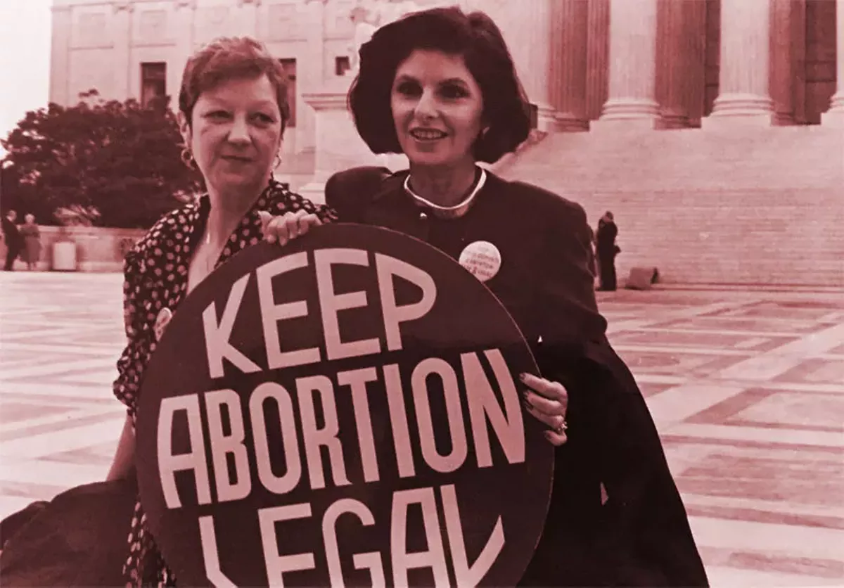 Norma McCorvey (Jane Roe) and her lawyer Gloria Allred on the steps of the Supreme Court, 1989.