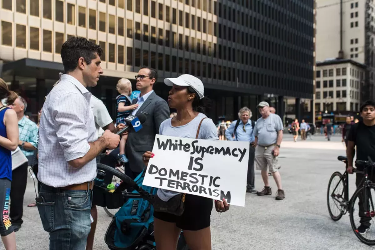 Image: A protester against white supremacy in Chicago after the Charlottesville riot.