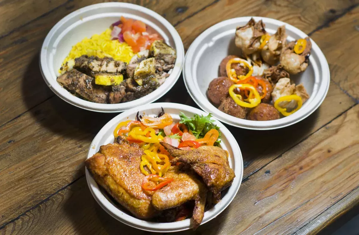 Image: Suya fried chicken (bottoam), lemon jerk chicken (left), corn cakes and plantain wontons (right).