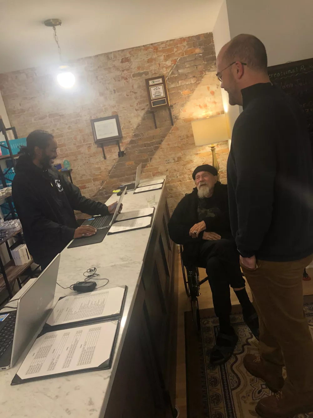 Activist John Sinclair, center, was among the first to buy legal pot on Sunday.