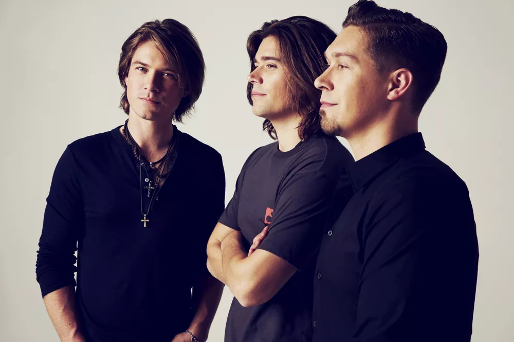 Flesh, blood, and MMMbop: the men of Hanson.