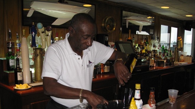 Jerome Adams mixes his signature drink behind the bar at Bayview Yacht Club.