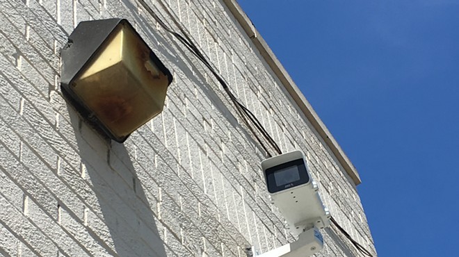 A Project Green Light camera at State Farm Insurance on 7 Mile and Livernois. The real-time crime monitoring program is drawing scrutiny as it expands to Detroit schools.