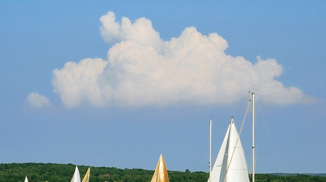 Sailboats on the blue water of Grand Traverse Bay.