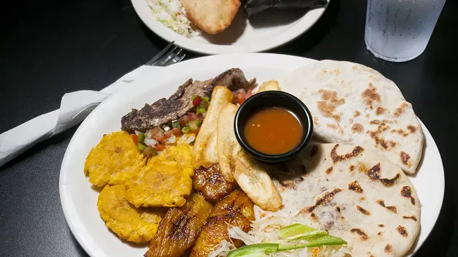 Pupusa, baleada, carne asada, tostones, platano maduro and tajadas at El Catracho.