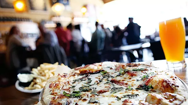 A Margherita pizza, truffle fries, and North Peak Diabolical IPA, from Jolly Pumpkin in Detroit.