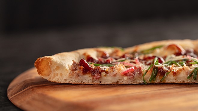 New York style pizza features a thin center crust with a crispy outer crust.