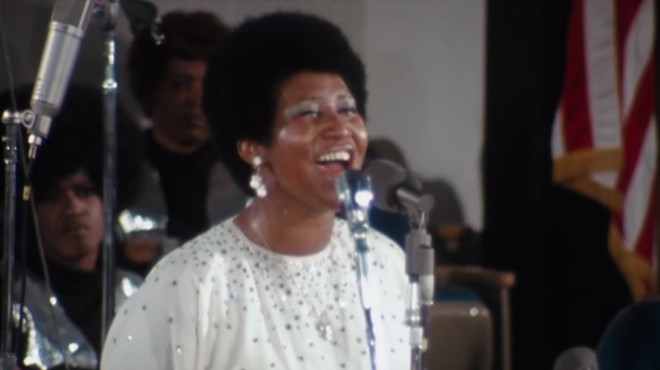 Aretha Franklin singing to the congregation at New Temple Missionary Baptist Church.