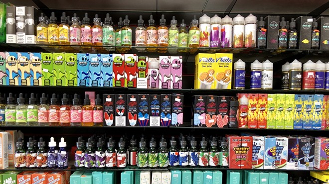 Flavored e-cigarette concentrates for sale at a Detroit store. Under Michigan's new ban, anyone possessing four or more "flavored vapor products or alternative nicotine products" faces a penalty of up to six months in jail.