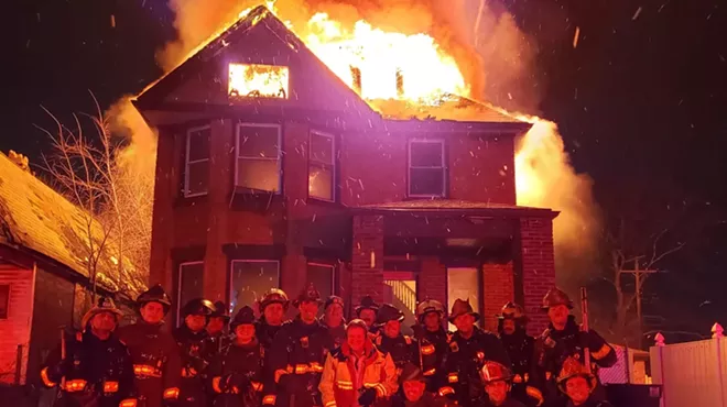 Image: Detroit firefighters disciplined for posing in front of burning house