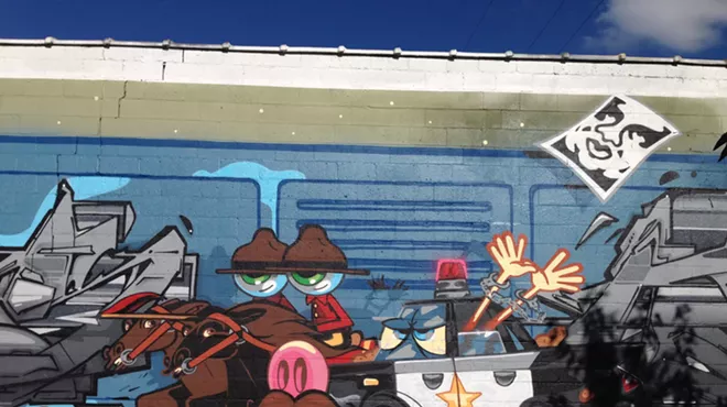 A collaborative mural between the artists Pursue and Kwest references current Shepard Fairey's legal troubles in Detroit.