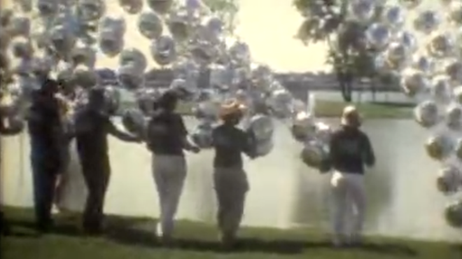 Crews assemble the artwork "Floating River" in June of 1986.