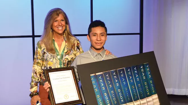 Pictures of Hope founder Linda Solomon with 13-year-old Cesar Chavez Middle School student Cristian Luz-Gutierrez during a reception Thursday at WXYZ.