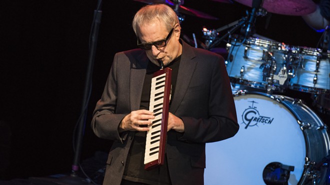 Steely Dan's Donald Fagen plays a melodica during a Wednesday show at DTE Energy Music Theater.