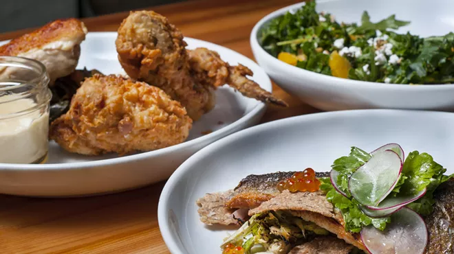 Clockwise, from left: 1/2 Chicken 2 Ways, Loup de Mer, and Kale and Grain salad.