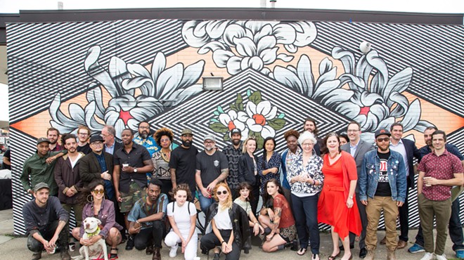 Some of Murals in the Markets' participating artists, photographed at a launch event at Eastern Market.