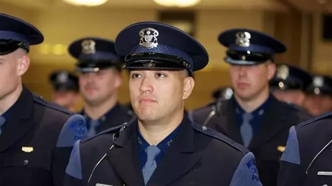 Bessner, among a sea of other white officers, during his Michigan State Trooper graduation in 2012.