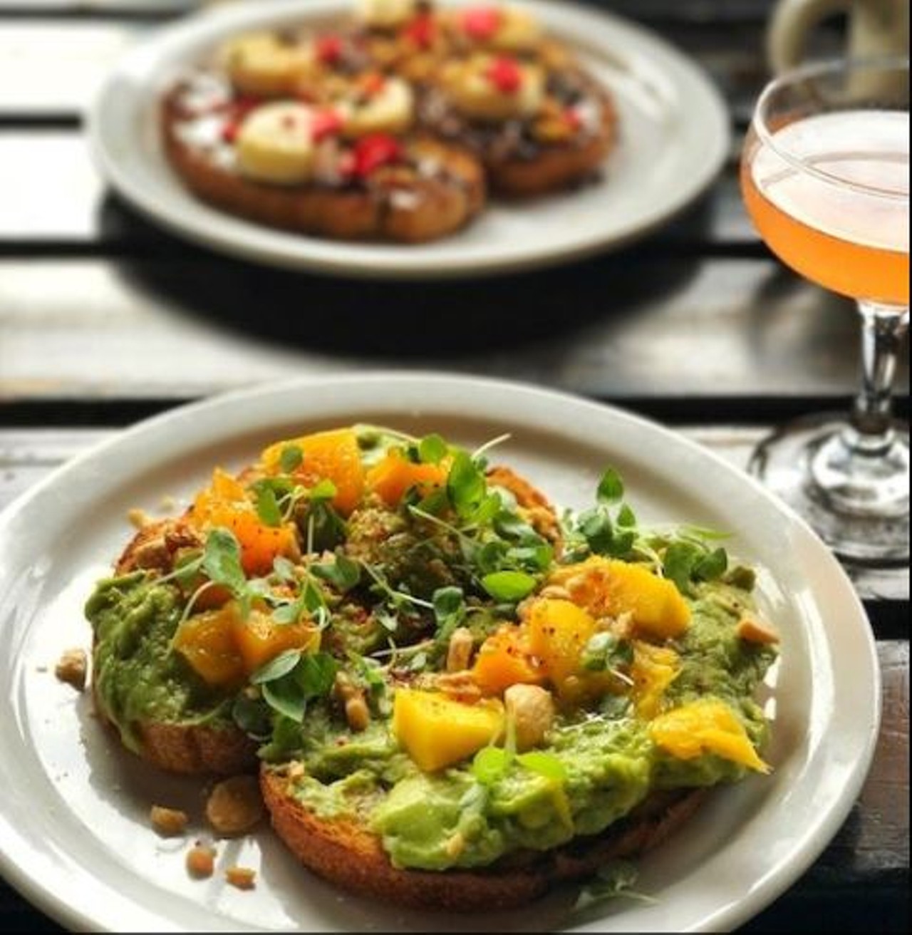 What to order - Avocado Toast
Instead of buying a home opt for the classic hipster dish. Ask for the Avocado toast on Avalon sourdough with smashed avocado, mango, chilies, Marcona, almonds and microgreens.
Photo via Aparna B
