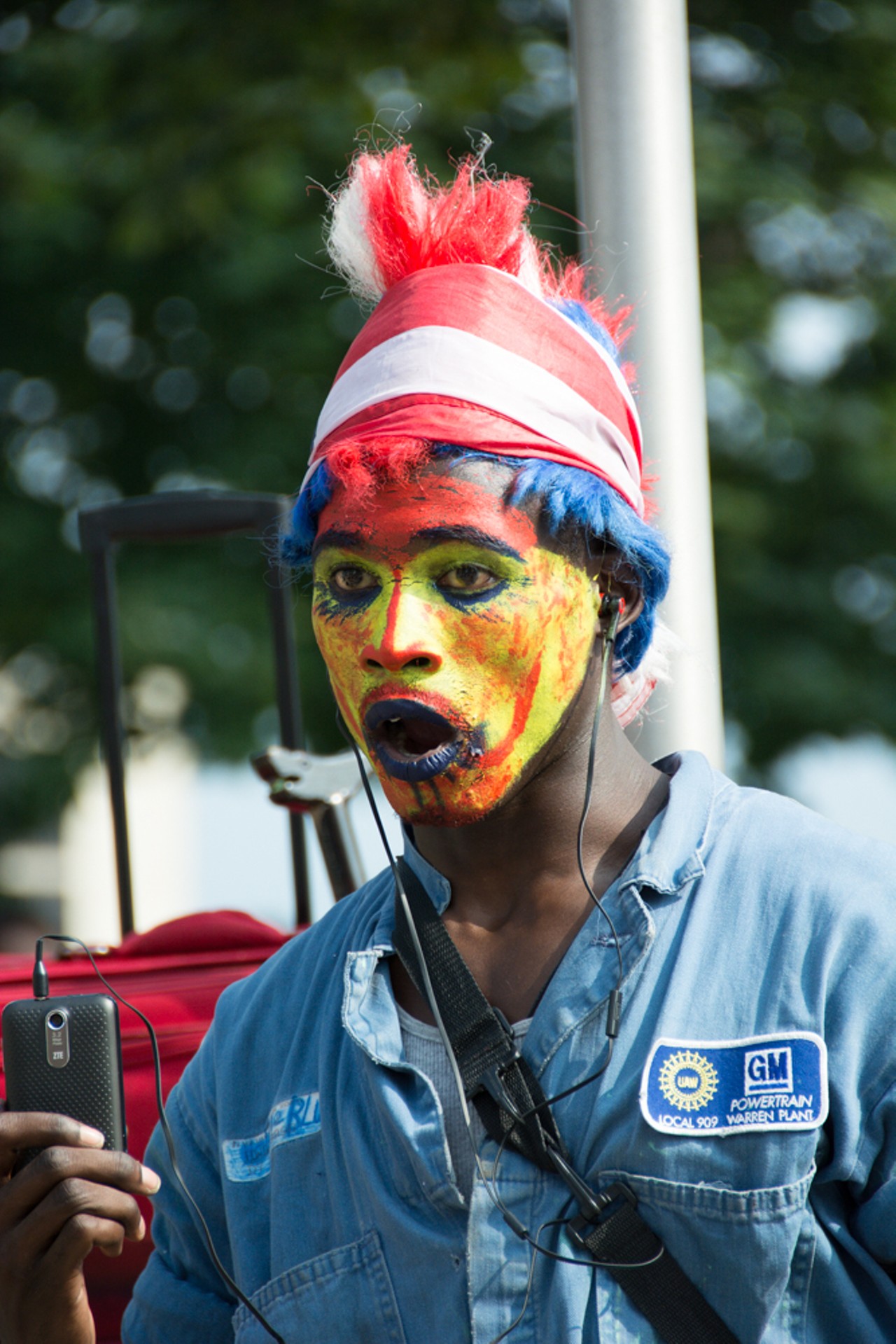 A street performer with very fashionable makeup.
