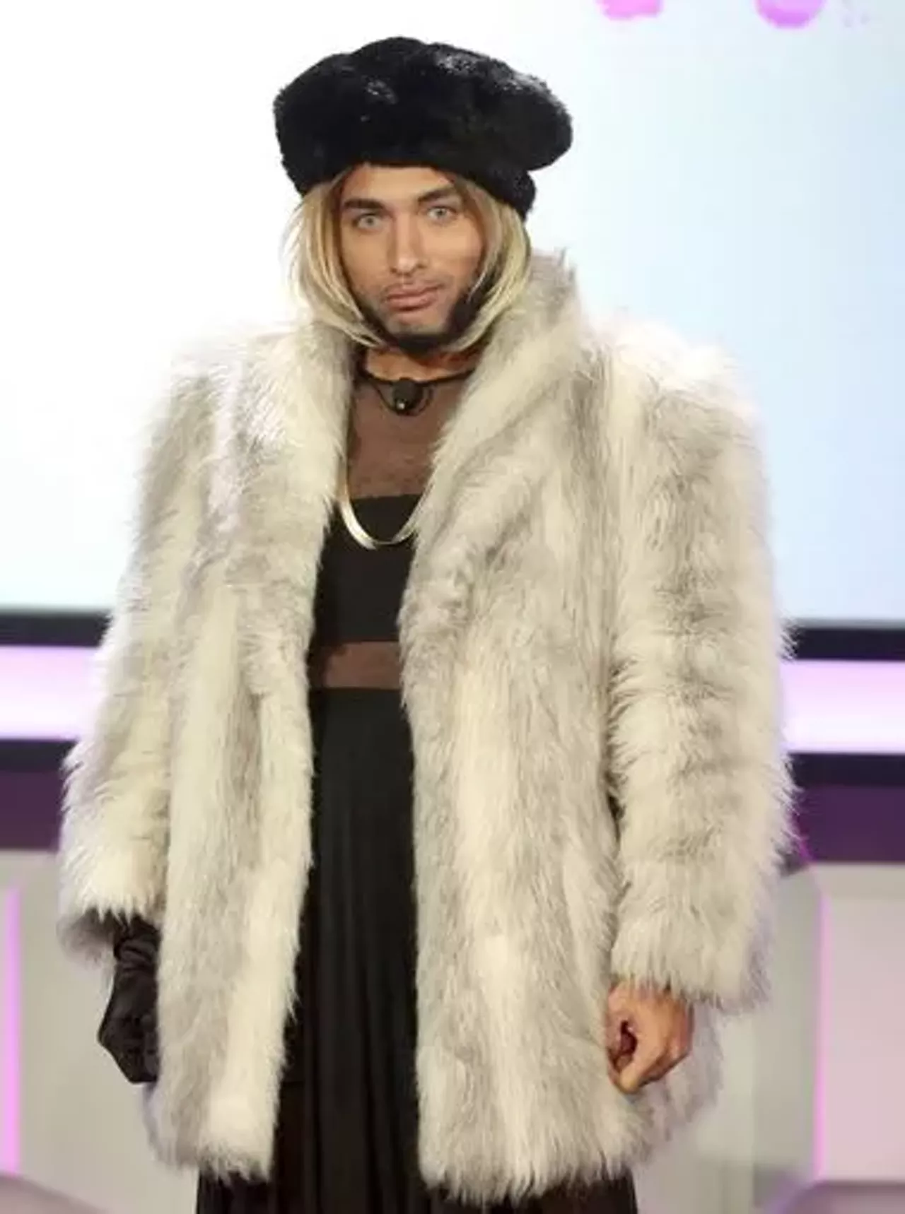 Ah... The infamous Joanne the Scammer. To be this pop culture icon you need a big faux fur coat, black mesh cutout dress, black faux fur hat, and of course &#151; a blonde wig, Photo courtesy of Zimbo 