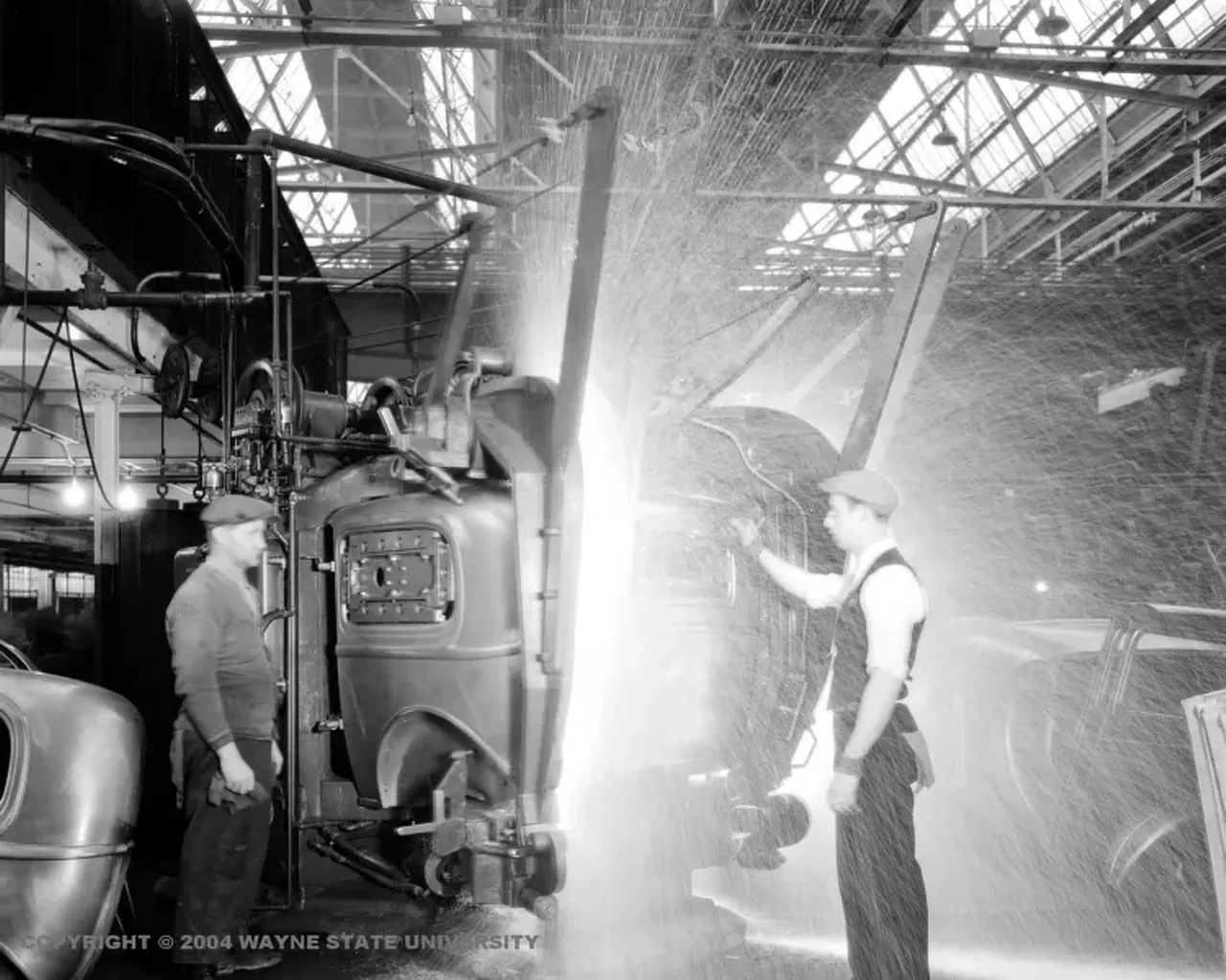 1930s - Ford Motor Company in River Rouge Welders working on the back and sides of a car.