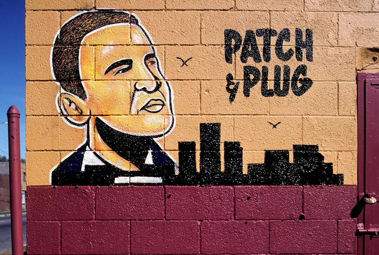 In his piece in "The Nation" today, Camilo Jose Vergara notes that the murals decorating inner-city businesses trade upon "symbols, motifs, and iconic figures to remind people of their roots and aspirations." A case in point would be this portrait of Obama he photographed in 2009 at Frank Tires #1, 4270 E. Seven Mile Rd., Detroit. The mural was painted by an artists known as "Ron."