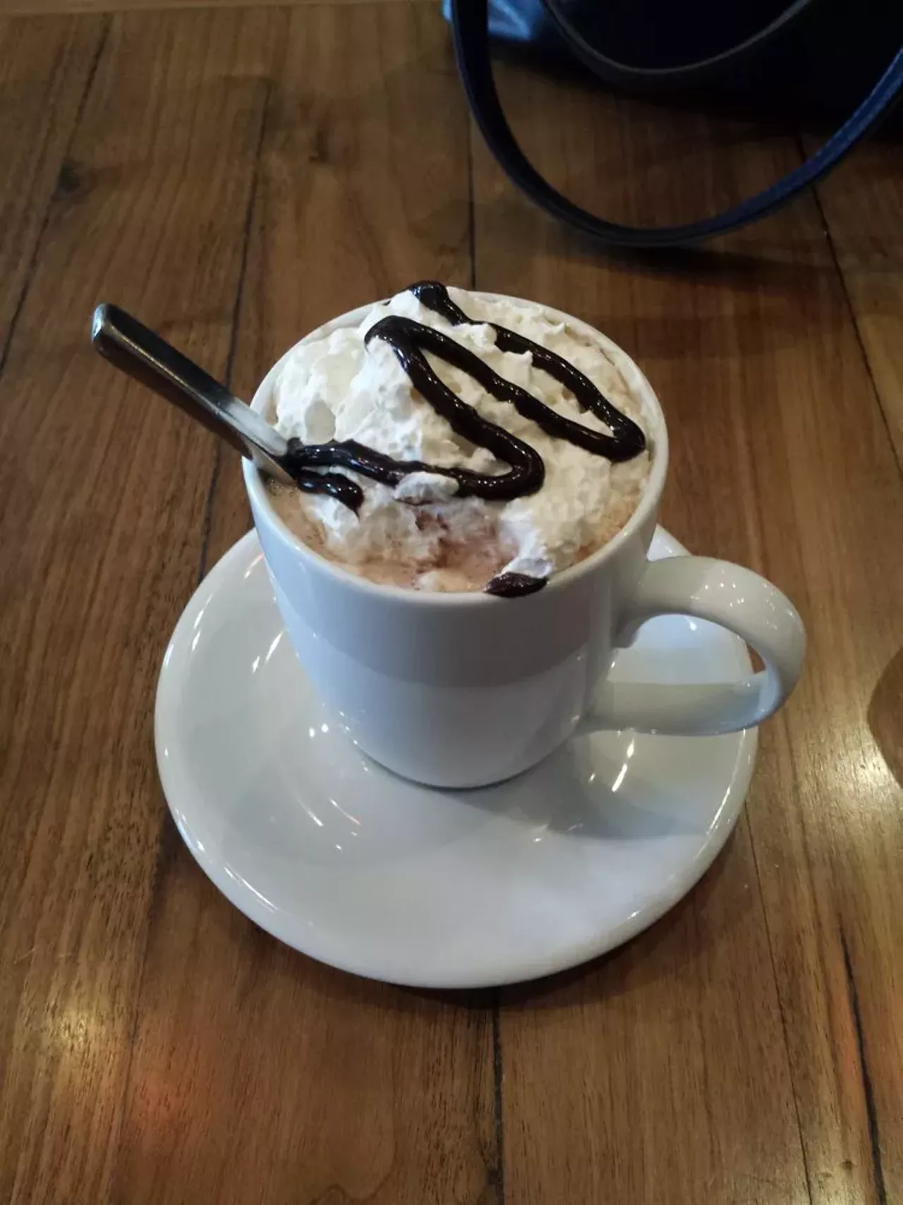 Cafe Muse - 418 S. Washington, Royal Oak - 248-544-4749 - With an emphasis on fresh, local ingredients it is no surprise that the decadent hot chocolate at Cafe Muse comes with a generous topping of fresh whipped cream.